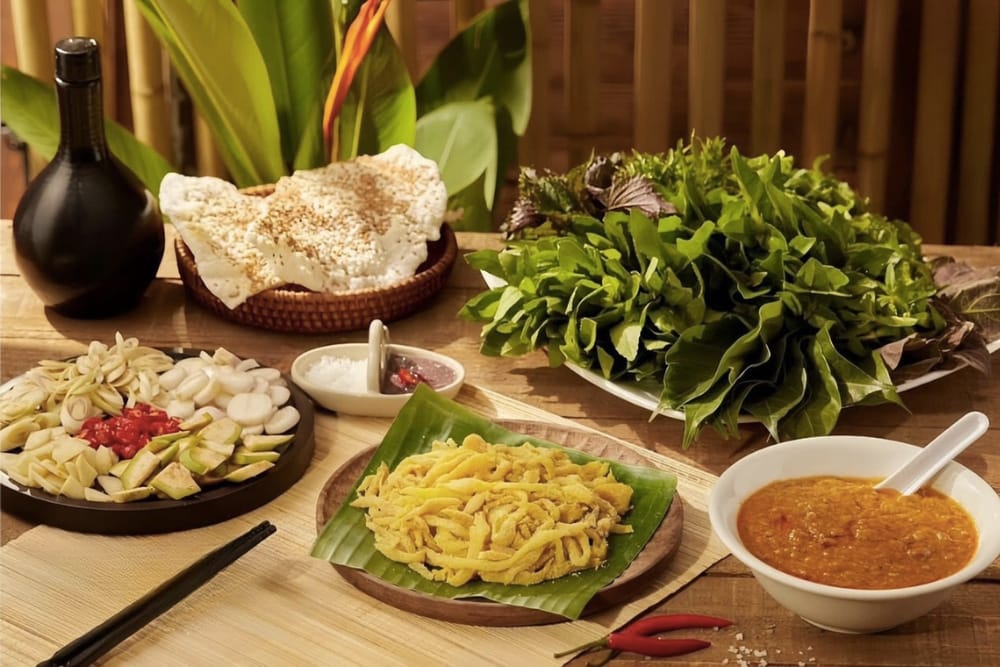 A collage of must-try Ninh Binh specialties, including mountain goat, ốc núi, and cơm cháy