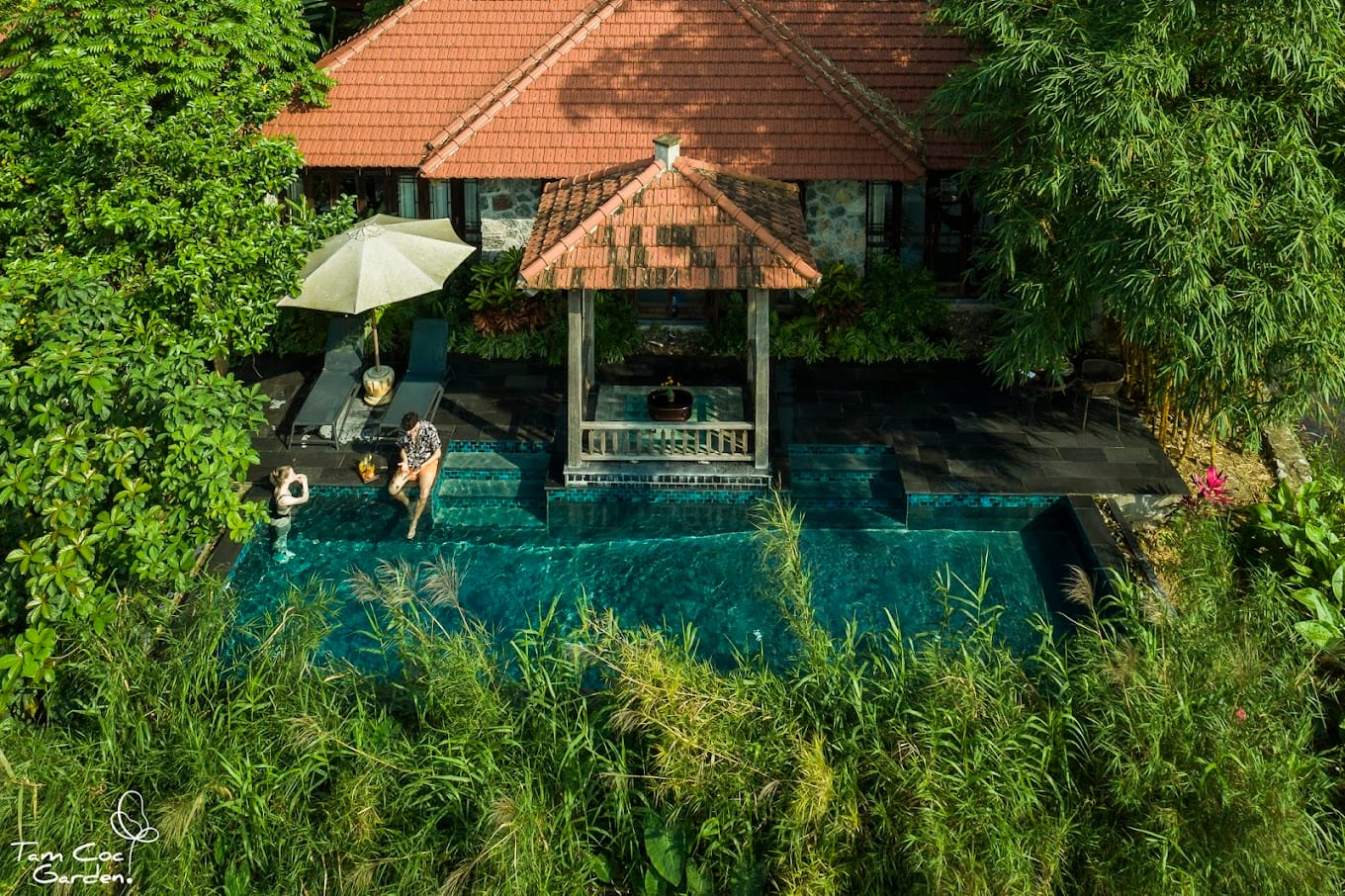 The cozy, warm interiors of a bungalow, utilizing natural materials at this Travelers’ Choice luxury hotel in Ninh Binh