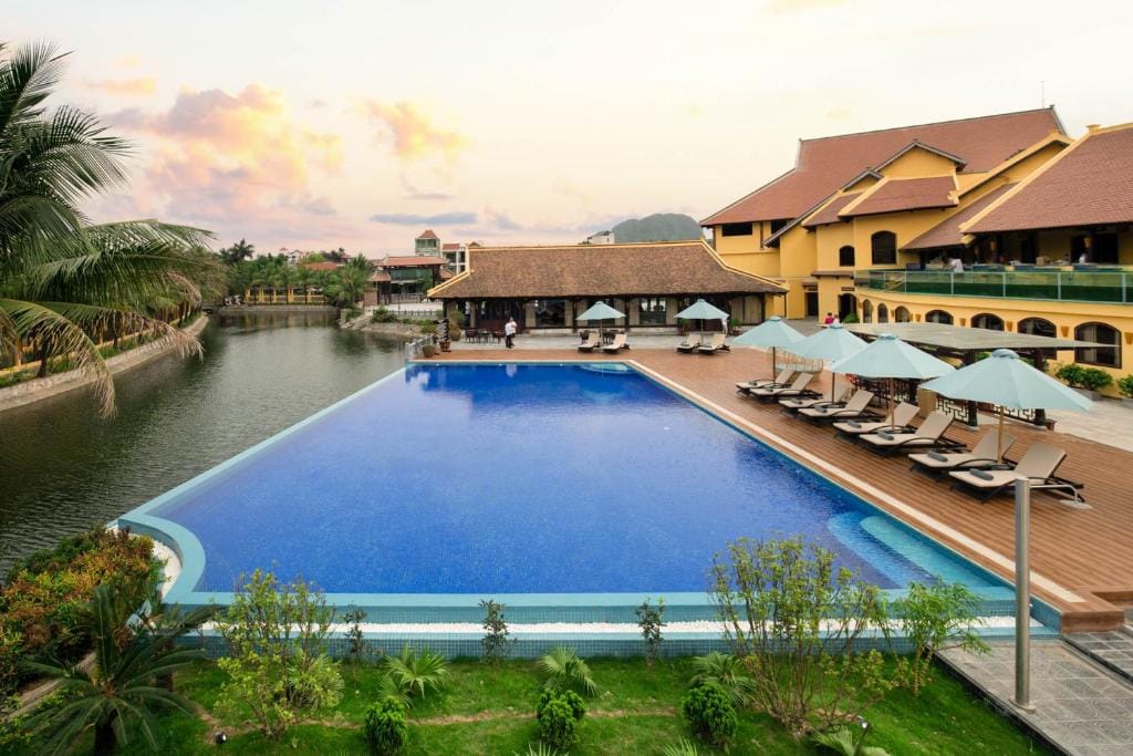 Relaxing by the expansive outdoor pool, a feature provided by Emeralda.