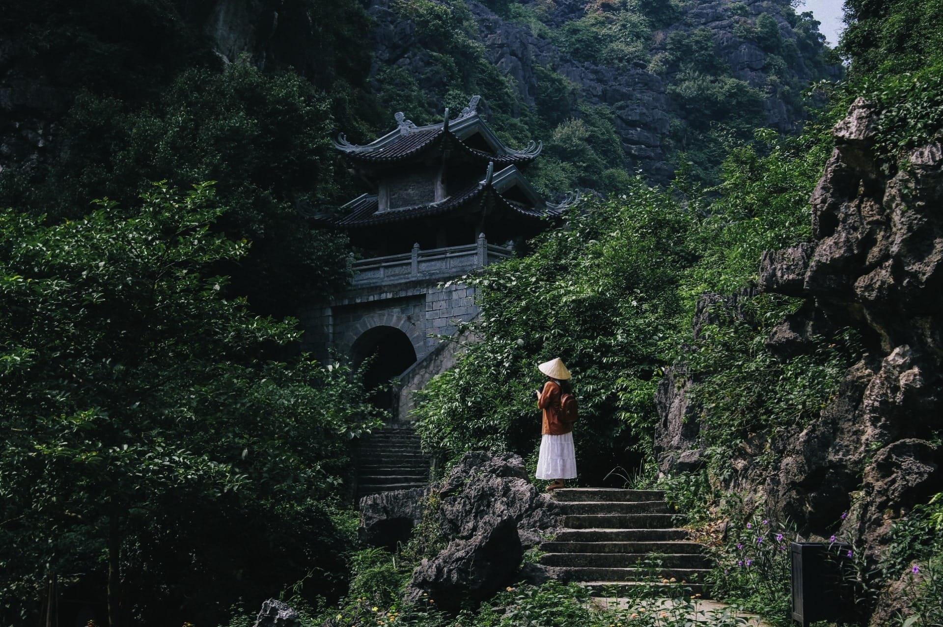 stunning wide shot of steep, dramatic limestone cliffs wrapping around a silent, pristine mountain basin