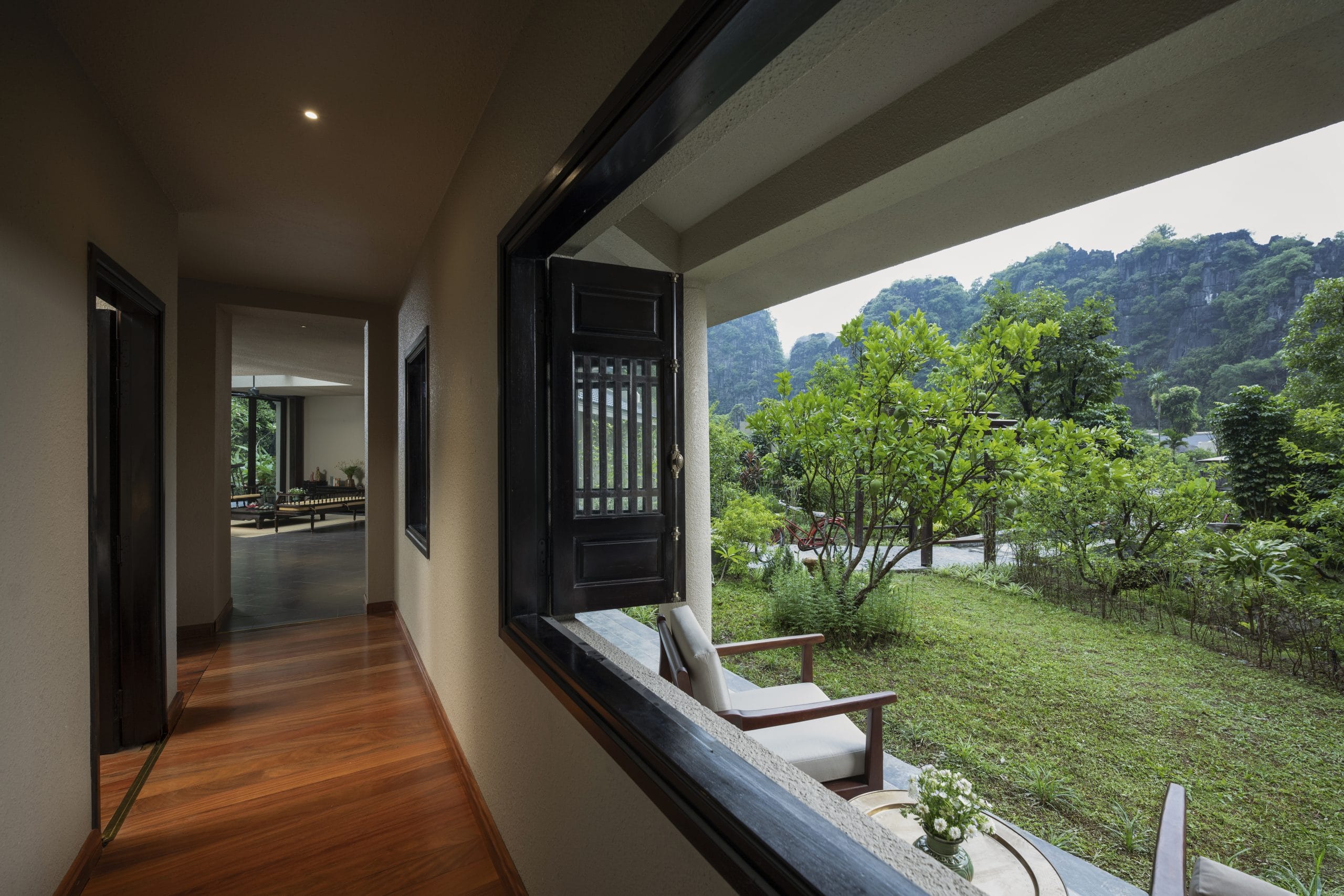 Elegant architecture meets rustic charm: A glimpse into the peaceful living spaces at Jiva Hoa Lu Retreat.
