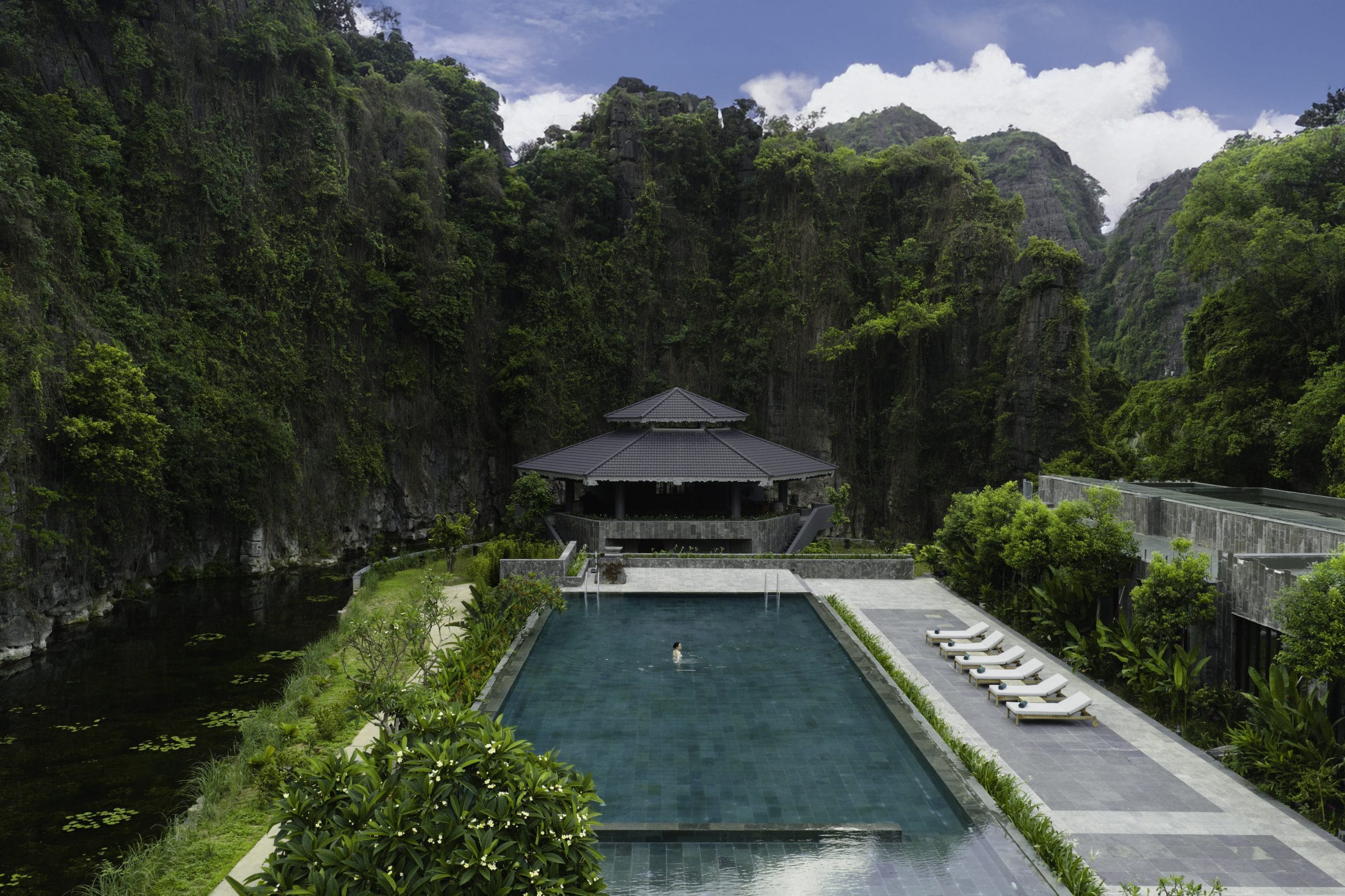 The soul-soothing infinity pool at Jiva Hoa Lu Retreat, overlooking the majestic limestone mountains of Ninh Binh.