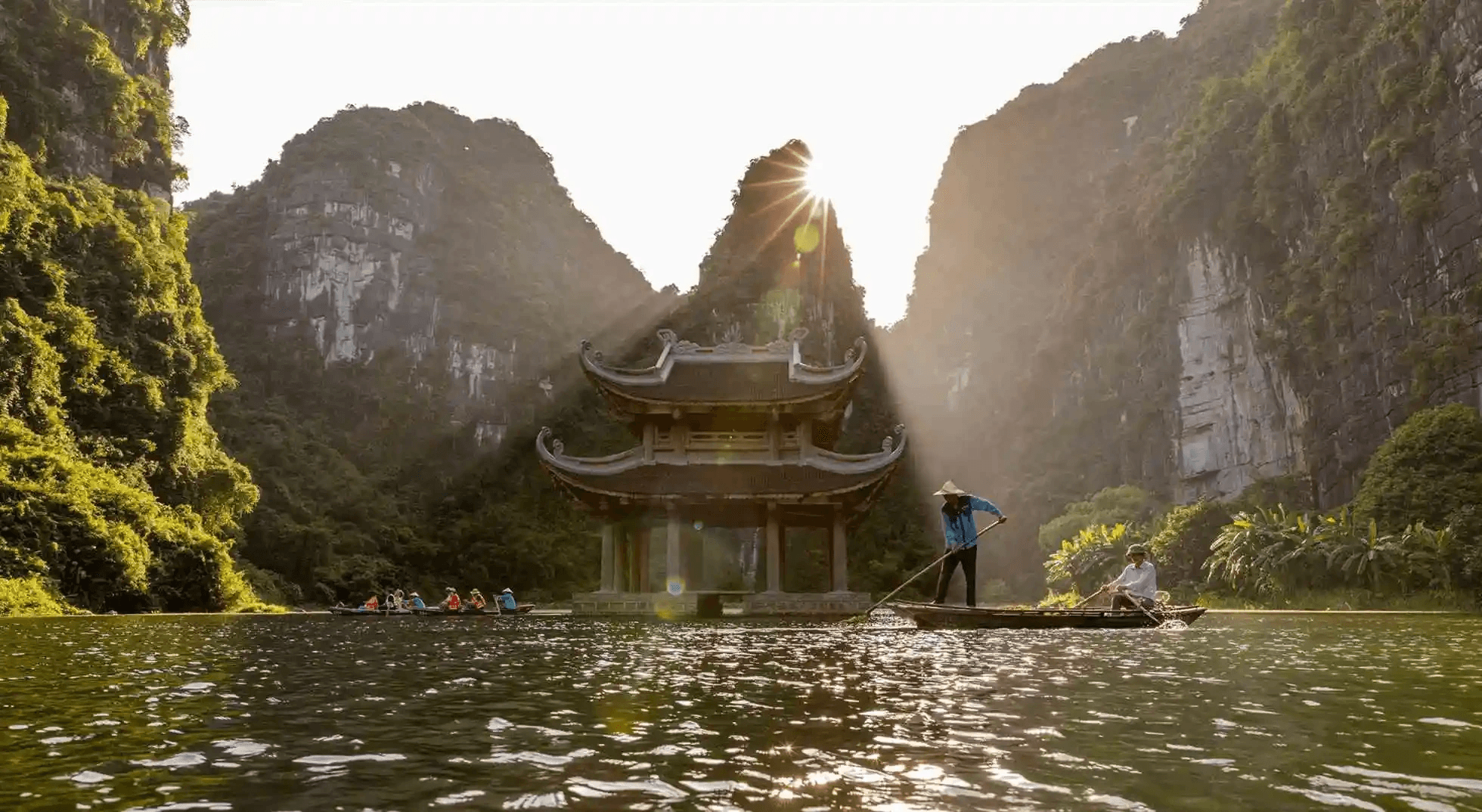 Cruising through UNESCO World Heritage river caves on Day 3 of your ninh binh 4 days journey.