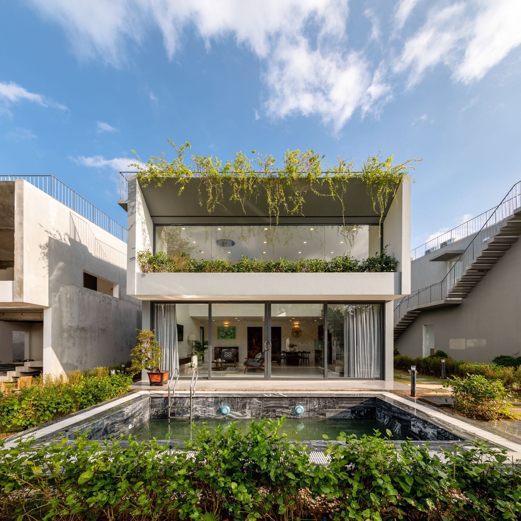The striking contemporary design of the Vedana Villa, often featuring bamboo structures and lake views.