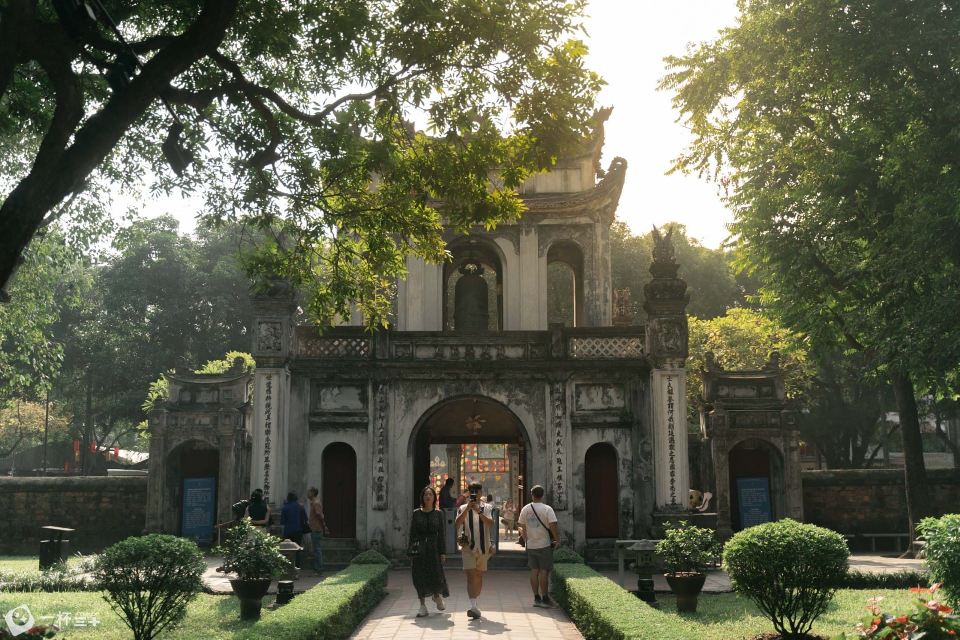 The bustling city of Hanoi converging with the peaceful, ancient traditions preserved at the Temple of Literature Hanoi.