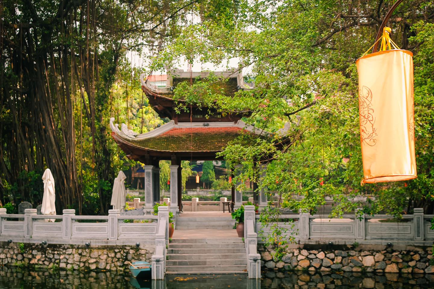 The picturesque Văn Hồ (Literature Lake), creating a peaceful, contemplative mood at the entrance.