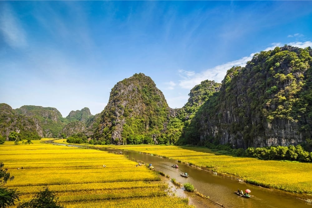 Capturing the breathtaking reflections of karst mountains on the still waters of the Ngo Dong River.
