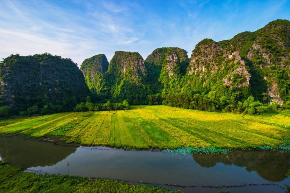 Experience the slow-paced beauty and poetic landscapes of Northern Vietnam’s most iconic waterway.