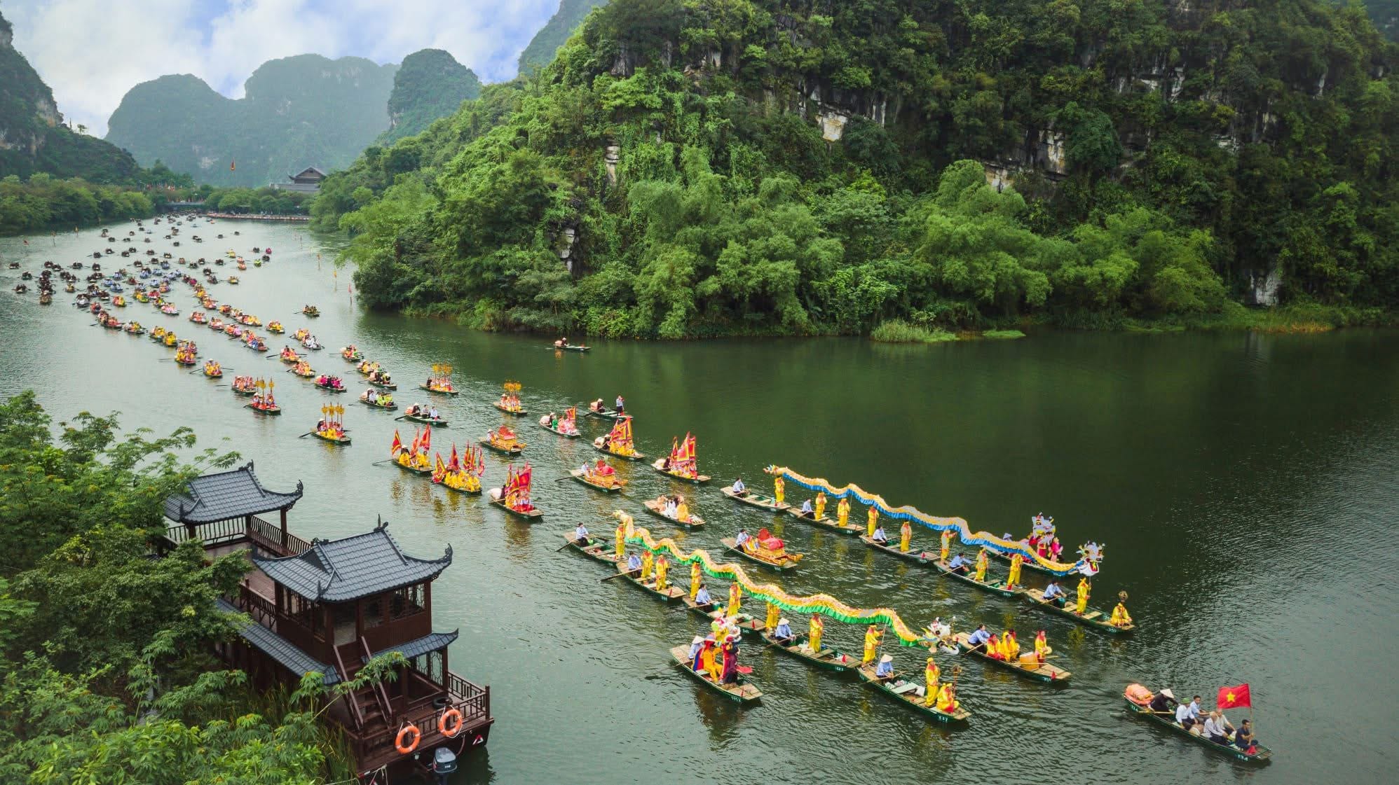 Traditional folk games and cultural activities, such as the re-enactment of the Cờ Lau battle, at the annual festival.