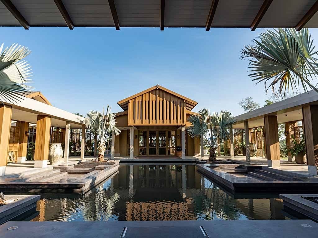 A luxurious private villa with a pool, reflecting the high-end sophistication of the retreat.