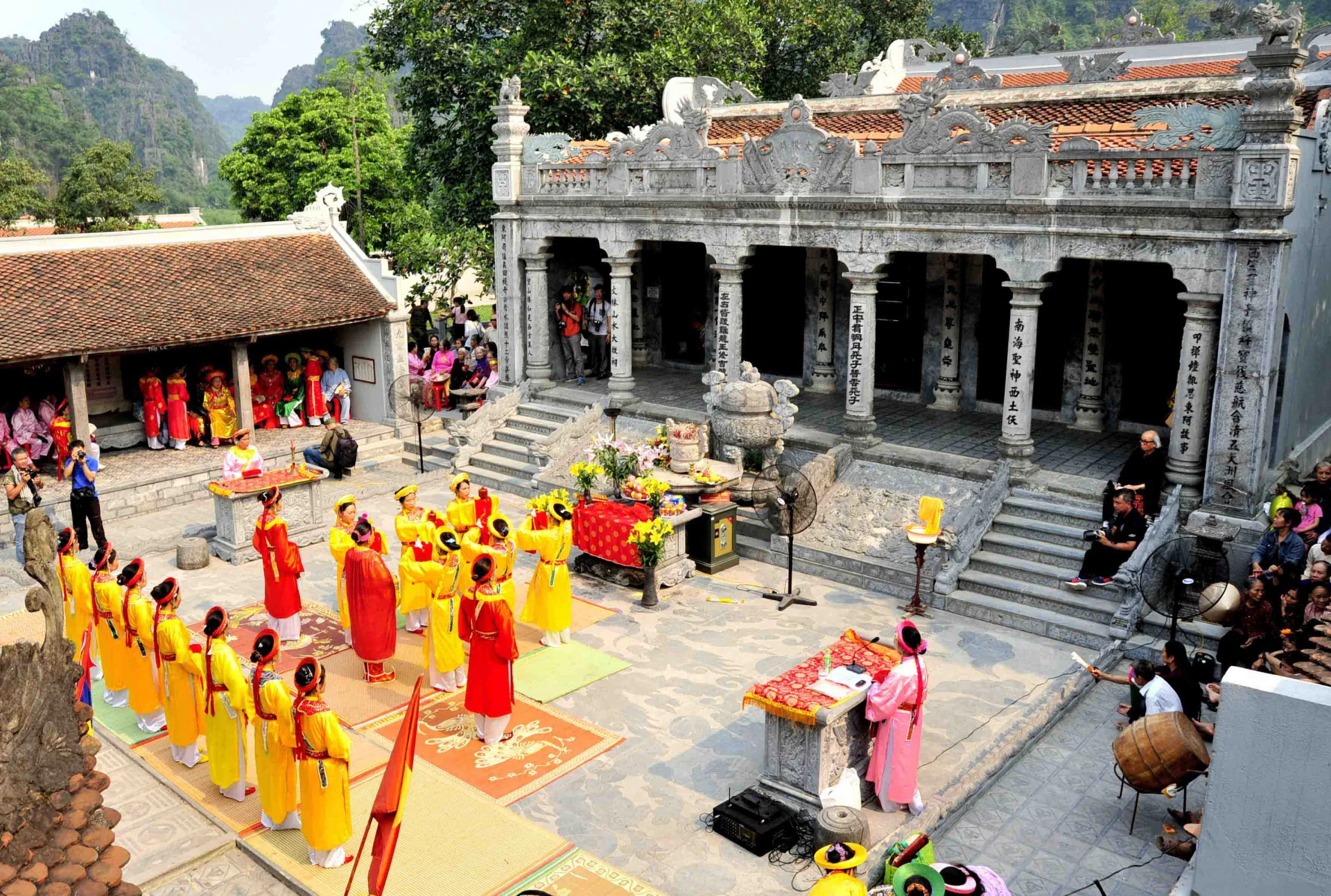 Locals performing traditional ceremonies and martial arts during the culturally significant festival.