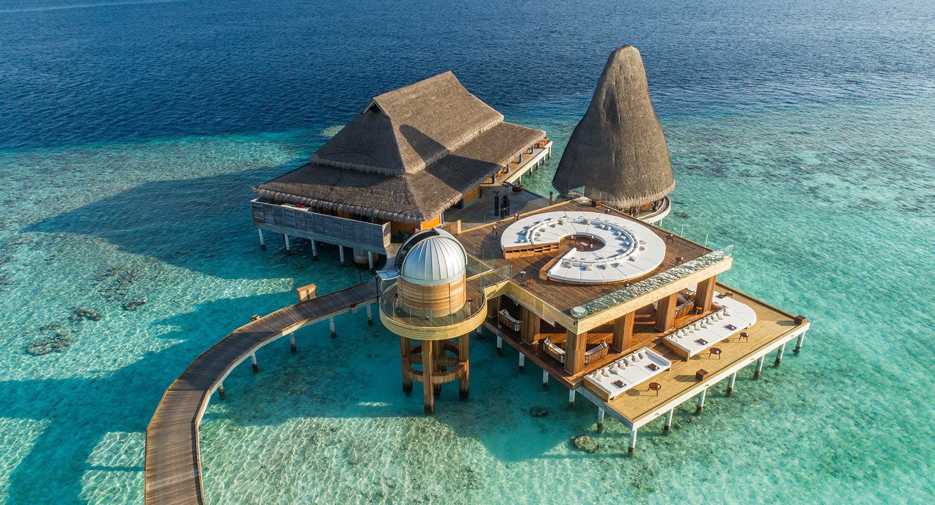 Over-water spa sanctuaries, providing personalized Ayurvedic and holistic rituals amidst the turquoise ocean.