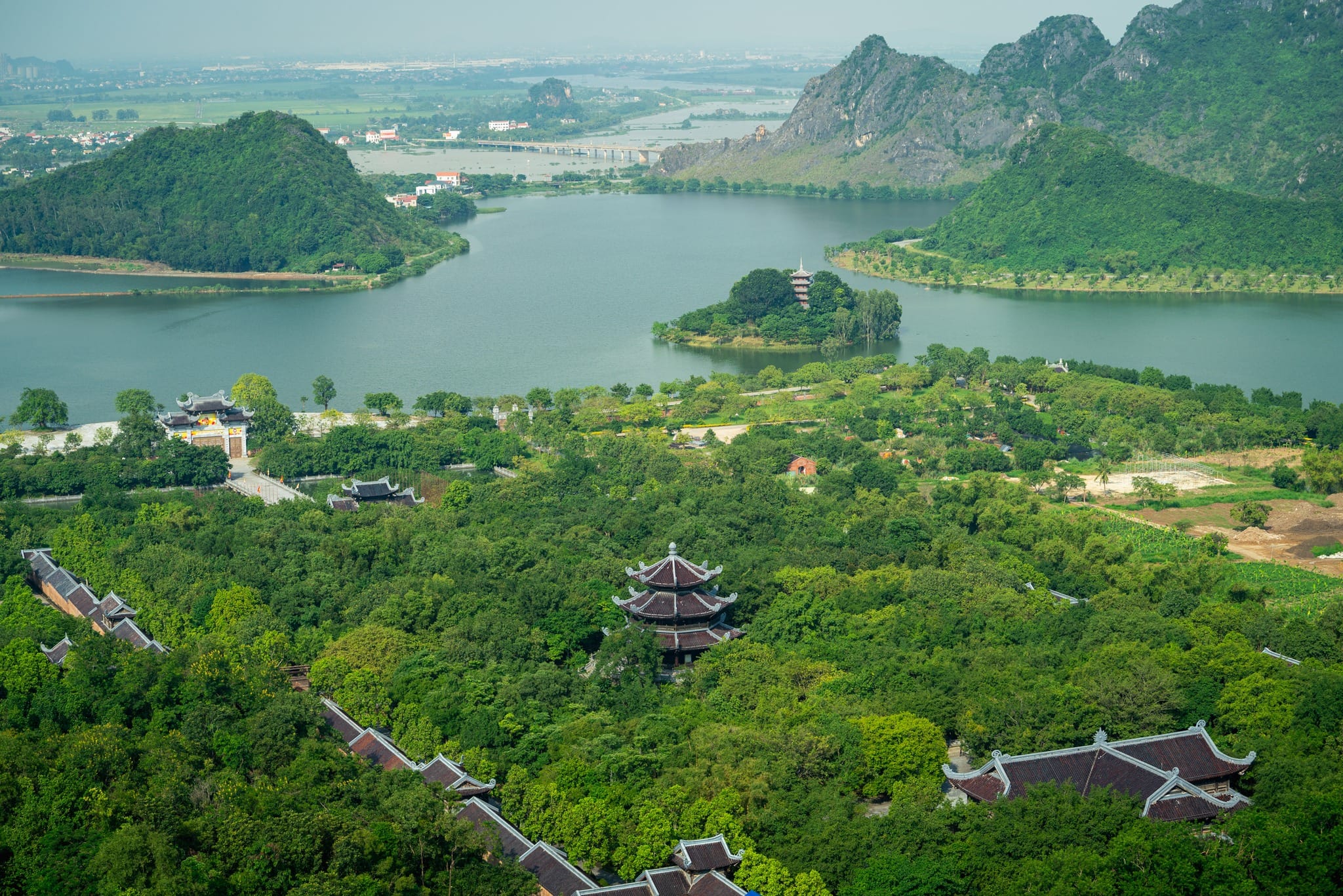 An aerial shot showing Bai Dinh Pagoda nestled within the stunning Trang An Scenic Landscape Complex.
