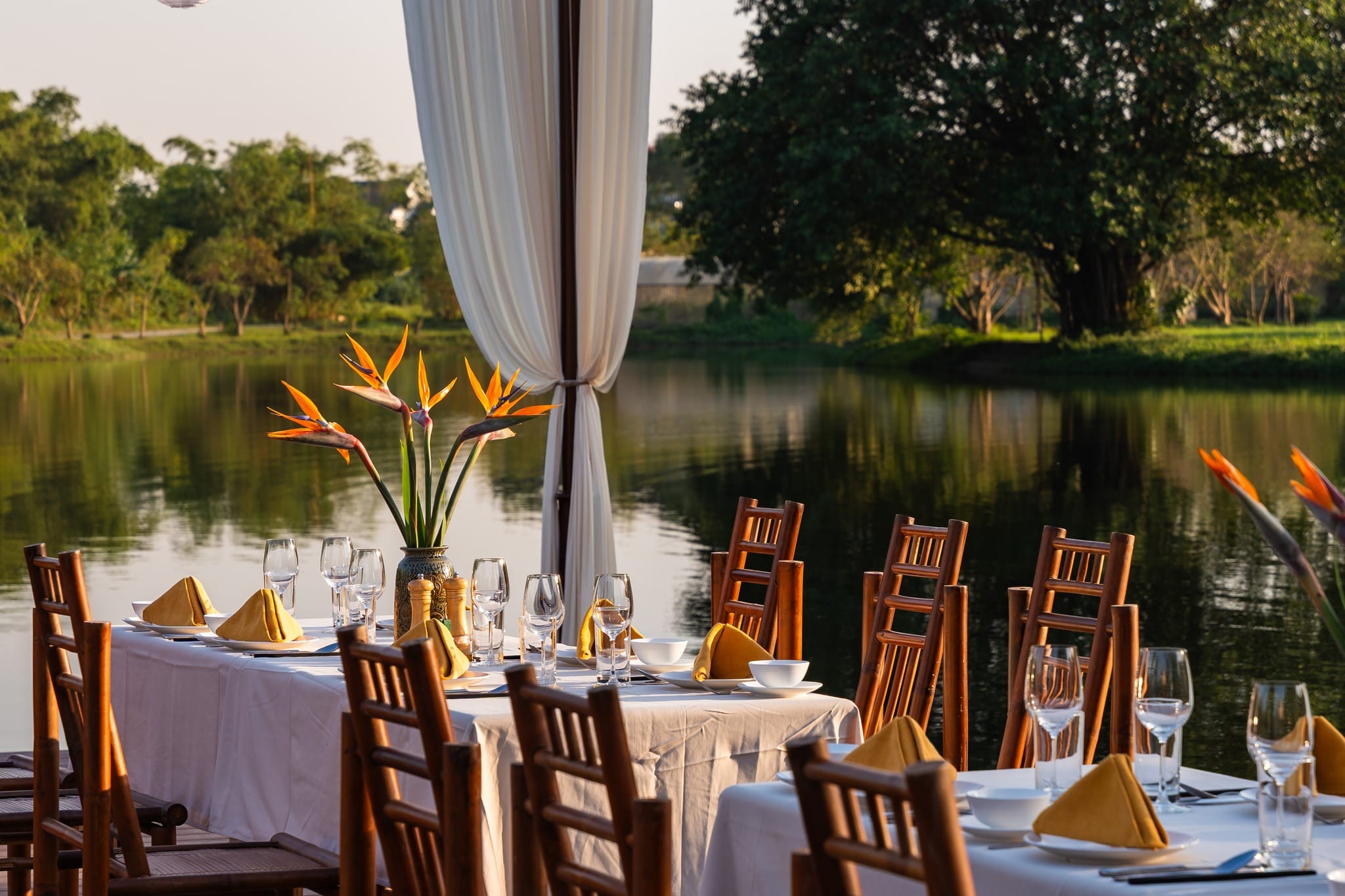 A romantic setting for dinner, overlooking the rice fields as the sun sets behind the limestone peaks.