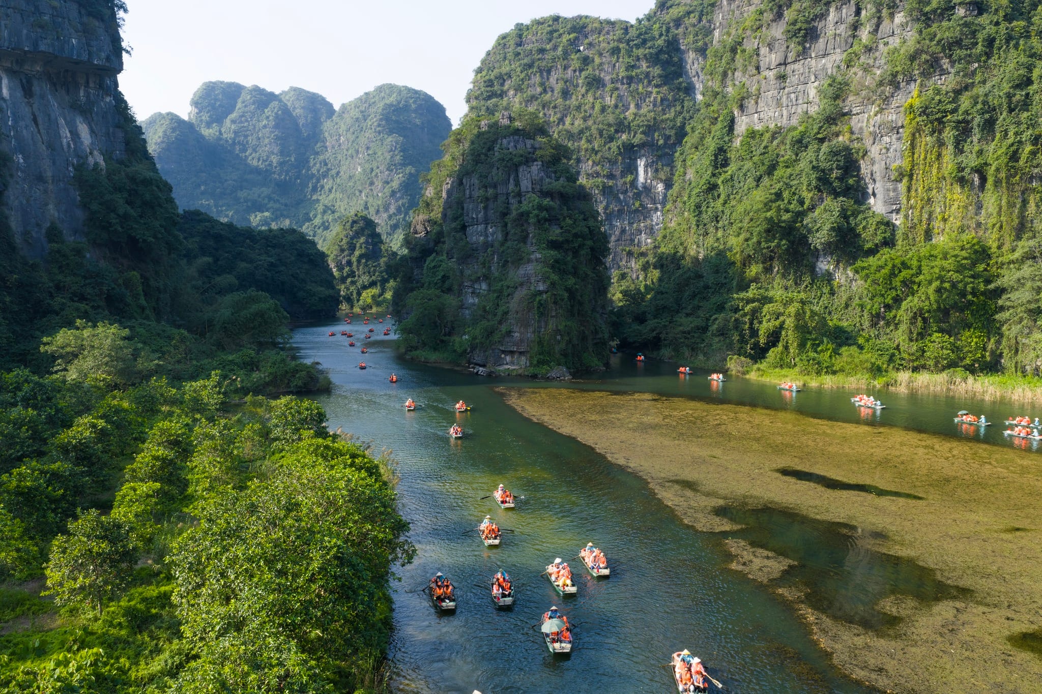 The tranquil waters of the Van Long Wetland Nature Reserve, located just 800m from a top Ninh Binh Luxury Resort.