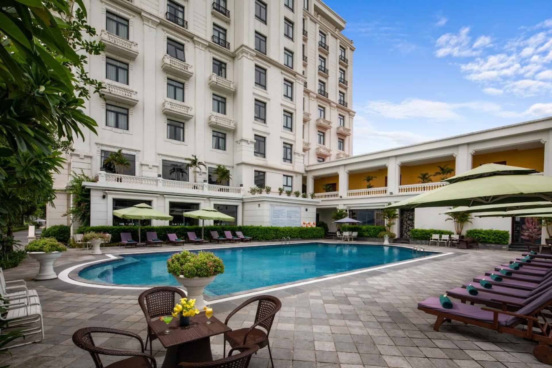The relaxing pool area, an ideal spot to unwind after exploring near your Trang An Resort.