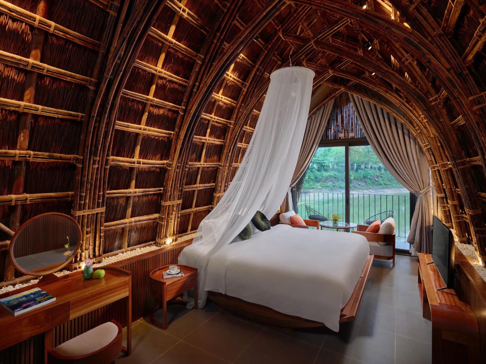 Soothing lake views from a spacious villa nestled deeply into the peaceful Ninh Binh mountains.