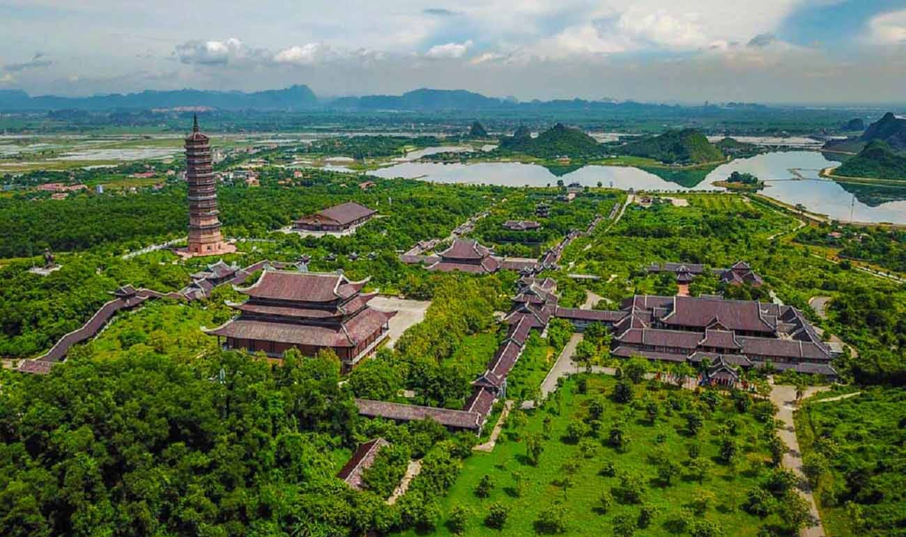The massive scale of the new complex, showcasing its towering structures against the backdrop of the Ninh Binh mountains.