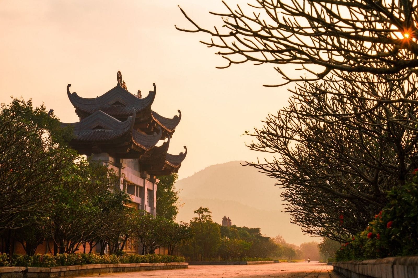 walking along the grand stone corridors lined with hundreds of Arhat statues at Bai Dinh Pagoda.