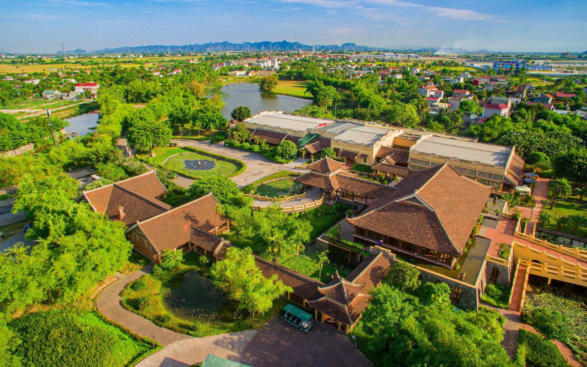 An aerial view of Emeralda Resort's expansive compound, featuring villa-style rooms and lush greenery.