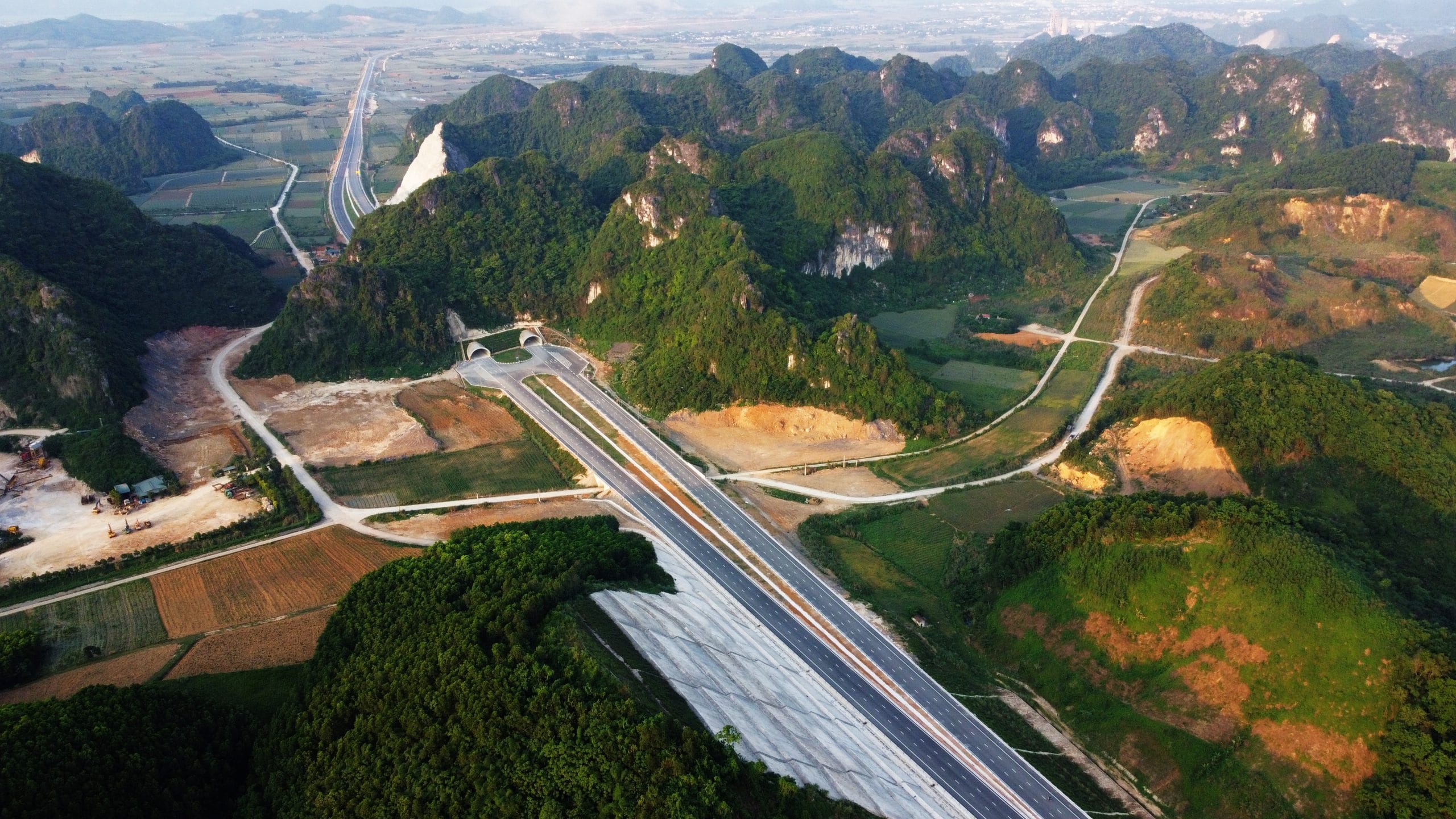 A straight forward highway through mountains & paddy feilds, connecting travelers with the stillness of the limestone karst landscape.