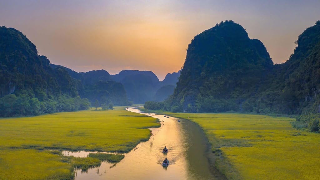 Comparing the cinematic scale of Trang An vs Tam Coc for photographers.