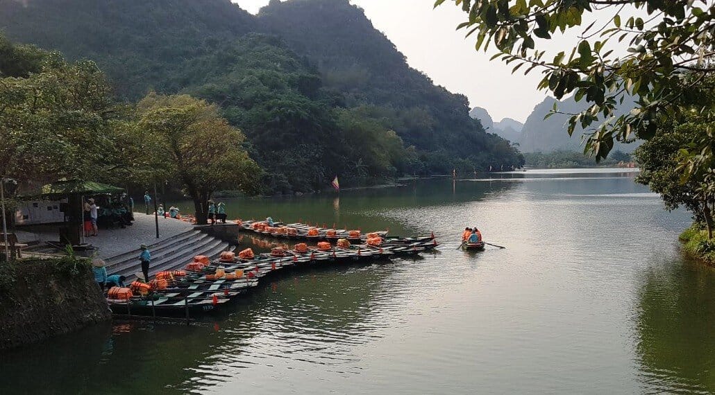 Which waterway wins the Trang An vs Tam Coc debate for romantic travelers?
