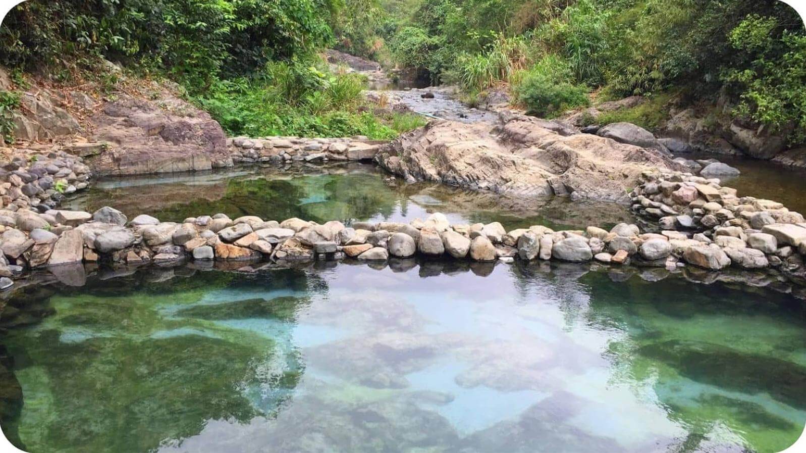relaxing near the soothing, steaming waters of a hidden natural hot mineral spring